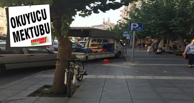 Süpermarketin sebze arabası engelli araç yerine park ediyor